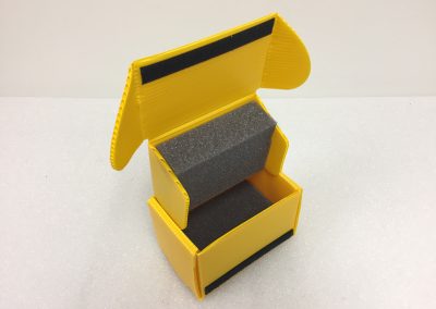 Reusable foam-lined tray staged for a production line