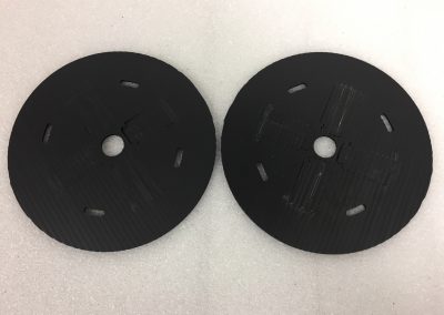 Returnable divider set holding machined parts upright in a tote