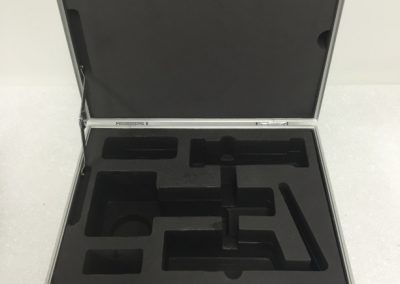 Small returnable case insert protecting precision parts