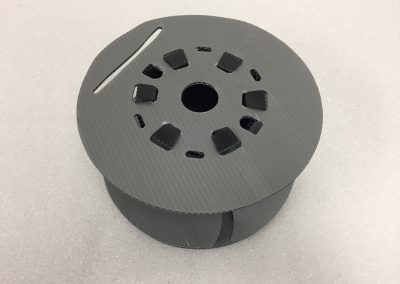 Reusable foam-lined tray staged for a production line